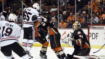 May 19, 2015; Anaheim, CA, USA; Chicago Blackhawks center Andrew Shaw (65) headbutts the puck into the net past Anaheim Ducks defenseman Francois Beauchemin (23) and goalie Frederik Andersen (31) during the second overtime period in game two of the Western Conference Final of the 2015 Stanley Cup Playoffs at Honda Center. Mandatory Credit: Kelvin Kuo-USA TODAY Sports
