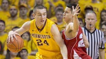 Mar 5, 2015; Minneapolis, MN, USA; Minnesota Golden Gophers forward Joey King (24) attempts to drive to the basket against Wisconsin Badgers guard Bronson Koenig (24) in the first half at Williams Arena. Mandatory Credit: Jesse Johnson-USA TODAY Sports