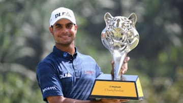 KUALA LUMPUR, MALAYSIA - FEBRUARY 04: Shubhankar Sharma of India poses with the trophy during day four of the Maybank Championship Malaysia at Saujana Golf and Country Club on February 4, 2018 in Kuala Lumpur, Malaysia. (Photo by Ross Kinnaird/Getty Images)