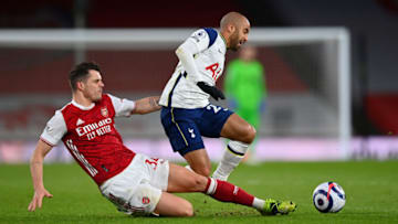 LONDON, ENGLAND - MARCH 14: Lucas Moura of Tottenham Hotspur is challenged by Granit Xhaka of Arsenal during the Premier League match between Arsenal and Tottenham Hotspur at Emirates Stadium on March 14, 2021 in London, England. (Photo by Dan Mullan/Getty Images)