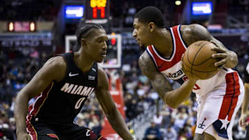 WASHINGTON, USA - MARCH 06: Washington Wizards Bradley Beal (3) keeps the ball away from Miami Heats Josh Richardson (0) at the Capital One Arena in Washington, United States on March 06, 2018. The game went into overtime with the Wizards coming out on top, 117-113. (Photo by Samuel Corum/Anadolu Agency/Getty Images)