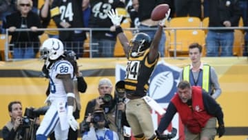 Oct 26, 2014; Pittsburgh, PA, USA; Pittsburgh Steelers wide receiver Antonio Brown (84) celebrates a touchdown in front of Indianapolis Colts cornerback Greg Toler (28) during the first half of their game at Heinz Field. Mandatory Credit: Jason Bridge-USA TODAY Sports