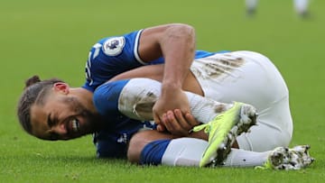 Everton's English striker Dominic Calvert-Lewin lies injured after a tackle by Newcastle United's Spanish midfielder Javier Manquillo during the English Premier League football match between Everton and Newcastle United at Goodison Park in Liverpool, north west England on January 30, 2021. (Photo by MOLLY DARLINGTON / POOL / AFP) / RESTRICTED TO EDITORIAL USE. No use with unauthorized audio, video, data, fixture lists, club/league logos or 'live' services. Online in-match use limited to 120 images. An additional 40 images may be used in extra time. No video emulation. Social media in-match use limited to 120 images. An additional 40 images may be used in extra time. No use in betting publications, games or single club/league/player publications. / (Photo by MOLLY DARLINGTON/POOL/AFP via Getty Images)