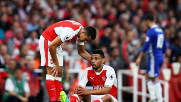 LONDON, ENGLAND - SEPTEMBER 24: Alexis Sanchez of Arsenal (L) checks that his team mate Francis Coquelin of Arsneal (C) is okay after being fouled during the Premier League match between Arsenal and Chelsea at the Emirates Stadium on September 24, 2016 in London, England. (Photo by Paul Gilham/Getty Images)