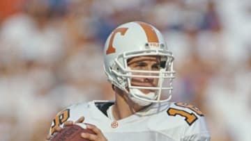 Peyton Manning #10, Quarterback for the University of Tennessee Volunteers runs the ball during the NCAA Southwest Conference college football game against the University of Florida Gators on 16 September 1995 at the Florida Field at Ben Hill Griffin Stadium, Gainesville, Florida, United States. The Florida Gators won the game 62 - 37. (Photo by Scott Halleran/Allsport/Getty Images)