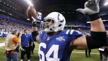 Jan 4, 2014; Indianapolis, IN, USA; Indianapolis Colts center Samson Satele (64) celebrates the victory against the Kansas City Chiefs during the 2013 AFC wild card playoff football game at Lucas Oil Stadium. Indianapolis defeats Kansas City 45-44. Mandatory Credit: Brian Spurlock-USA TODAY Sports
