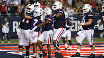 TUCSON, ARIZONA - SEPTEMBER 17: The Arizona Wildcats celebrate a touchdown by quarterback Jayden de Laura #7 of the Arizona Wildcats during the first half of the NCAA football game against the North Dakota State Bison at Arizona Stadium on September 17, 2022 in Tucson, Arizona. (Photo by Rebecca Noble/Getty Images)