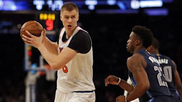 Nov 14, 2016; New York, NY, USA; New York Knicks forward Kristaps Porzingis (6) looks to pass around Dallas Mavericks guard Wesley Matthews (23) during the second half at Madison Square Garden. Mandatory Credit: Adam Hunger-USA TODAY Sports