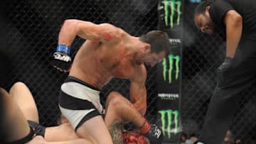 December 12, 2015; Las Vegas, NV, USA; Luke Rockhold lands punches against Chris Weidman during UFC 194 at MGM Grand Garden Arena. Mandatory Credit: Gary A. Vasquez-USA TODAY Sports