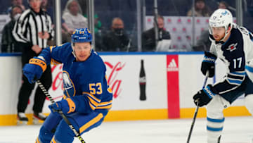BUFFALO, NY - MARCH 30: Jeff Skinner #53 of the Buffalo Sabres skates with the puck as Adam Lowry #17 of the Winnipeg Jets pursue the play during the first period at KeyBank Center on March 30, 2022 in Buffalo, New York. (Photo by Kevin Hoffman/Getty Images)