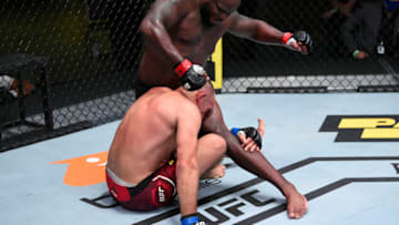LAS VEGAS, NEVADA - AUGUST 08: In this handout photo provided by UFC, (R-L) Derrick Lewis punches Aleksei Oleinik of Russia in their heavyweight fight during the UFC Fight Night event at UFC APEX on August 08, 2020 in Las Vegas, Nevada. (Photo by Chris Unger/Zuffa LLC via Getty Images)