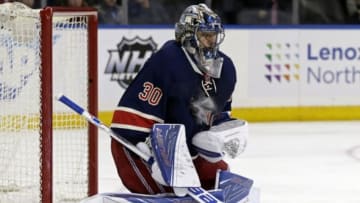 Jan 11, 2016; New York, NY, USA; New York Rangers goalie Henrik Lundqvist (30) makes a save against the Boston Bruins during the third period of an NHL hockey game at Madison Square Garden. The Rangers defeated the Bruins 2-1. Mandatory Credit: Adam Hunger-USA TODAY Sports