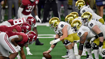 ARLINGTON, TEXAS - JANUARY 01: Zeke Correll #52 of the Notre Dame Fighting Irish sets the line during the College Football Playoff Semifinal at the Rose Bowl football game against the Alabama Crimson Tide at AT&T Stadium on January 01, 2021 in Arlington, Texas. The Alabama Crimson Tide defeated the Notre Dame Fighting Irish 31-14. (Photo by Alika Jenner/Getty Images)