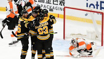 Jan 21, 2021; Boston, Massachusetts, USA; Boston Bruins left wing Nick Ritchie (21) celebrates with his teammates after scoring on Philadelphia Flyers goaltender Carter Hart (79) during the third period at the TD Garden. Mandatory Credit: Brian Fluharty-USA TODAY Sports