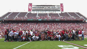 Apr 23, 2022; Norman, Oklahoma, USA; Oklahoma Sooners former players and family pose for a photo during the spring game at Gaylord Family Oklahoma Memorial Stadium. Mandatory Credit: Kevin Jairaj-USA TODAY Sports
