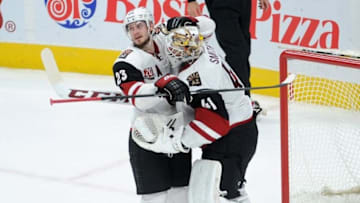 Nov 27, 2016; Edmonton, Alberta, CAN; Arizona Coyotes defenceman Oliver Ekman-Larssonn (23) celebrates their win with Arizona Coyotes goalie Mike Smith (41) at the end of the third period at Rogers Place. Coyotes won the game 2-1. Mandatory Credit: Walter Tychnowicz-USA TODAY Sports