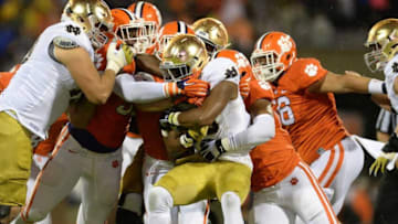 Clemson's defense brings down Notre Dame running back C.J. Prosise (20) during the 1st quarter Saturday, October 3, 2015 at Clemson's Memorial Stadium.Football 2015 Clemson Notre Dame