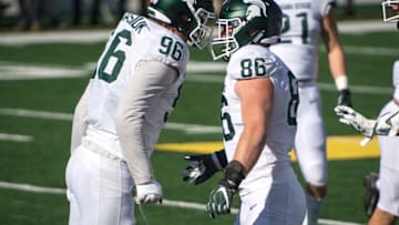 ANN ARBOR, MI - OCTOBER 31: Jacub Panasiuk #96 of the Michigan State Spartans and Drew Beesley #86 of the Michigan State Spartans celebrate during the first quarter against the Michigan Wolverines at Michigan Stadium on October 31, 2020 in Ann Arbor, Michigan. (Photo by Nic Antaya/Getty Images)