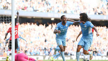 Raheem Sterling of Manchester City celebrates with teammate Nathan Ake (Photo by Laurence Griffiths/Getty Images)