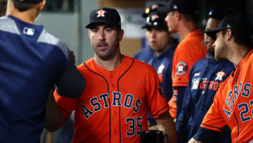 SEATTLE, WASHINGTON - JUNE 06: Justin Verlander #35 of the Houston Astros high fives teammates after exiting the game after giving up one run in seven innings against the Seattle Mariners during their game at T-Mobile Park on June 06, 2019 in Seattle, Washington. (Photo by Abbie Parr/Getty Images)