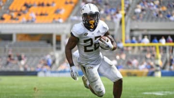 PITTSBURGH, PA - SEPTEMBER 15: Clinton Lynch #22 of the Georgia Tech Yellow Jackets runs for a 3 yard touchdown in the fourth quarter during the game against the Pittsburgh Panthers at Heinz Field on September 15, 2018 in Pittsburgh, Pennsylvania. (Photo by Justin Berl/Getty Images)
