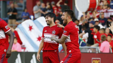 BRIDGEVIEW, ILLINOIS - JULY 03: Fancisco Calvo #5 of the Chicago Fire celebrates after Nicolas Gaitan #20 scoes a goal in the game against the Atlanta United FC at SeatGeek Stadium on July 03, 2019 in Bridgeview, Illinois. (Photo by Justin Casterline/Getty Images)