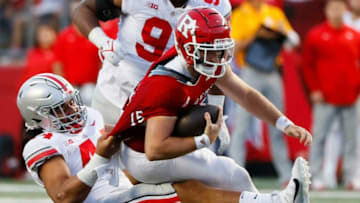 Ohio State Buckeyes defensive lineman J.T. Tuimoloau (44) brings down Rutgers Scarlet Knights quarterback Cole Snyder (15) during the fourth quarter of a NCAA Division I football game between the Rutgers Scarlet Knights and the Ohio State Buckeyes on Saturday, Oct. 2, 2021 at SHI Stadium in Piscataway, New Jersey.Cfb Ohio State Buckeyes At Rutgers Scarlet Knights