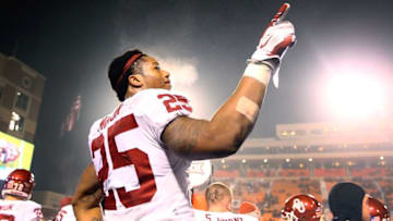 Nov 28, 2015; Stillwater, OK, USA; Oklahoma Sooners running back Joe Mixon (25) celebrates on the sidelines in the fourth quarter against the Oklahoma State Cowboys at Boone Pickens Stadium. The Sooners defeated the Cowboys 58-23. Mandatory Credit: Mark J. Rebilas-USA TODAY Sports