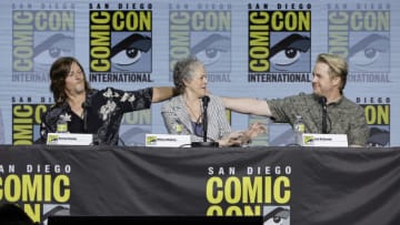 SAN DIEGO, CALIFORNIA - JULY 22: (L-R) Norman Reedus, Melissa McBride, and Josh McDermitt speak onstage at AMC's "The Walking Dead" panel during 2022 Comic-Con International: San Diego at San Diego Convention Center on July 22, 2022 in San Diego, California. (Photo by Kevin Winter/Getty Images)