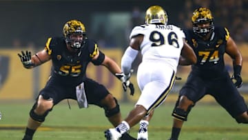 Sep 25, 2014; Tempe, AZ, USA; Arizona State Sun Devils offensive lineman Christian Westerman (55) and Jamil Douglas (74) against UCLA Bruins defensive lineman Eli Ankou (96) at Sun Devil Stadium. UCLA defeated Arizona State 62-27. Mandatory Credit: Mark J. Rebilas-USA TODAY Sports
