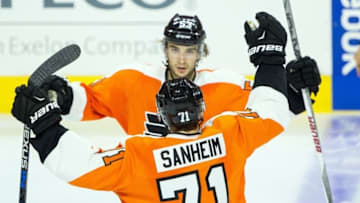 Sep 22, 2015; Philadelphia, PA, USA; Philadelphia Flyers defenseman Shayne Gostisbehere (53) celebrates his first goal of the game with defenseman Travis Sanheim (71) during the third period against the New York Rangers at Wells Fargo Center. The Flyers won 5-3. Mandatory Credit: Bill Streicher-USA TODAY Sports