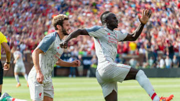 ANN ARBOR, MI - JULY 28: Adam Lallana #20 and Sadio Mane #10 of Liverpool celebrate after Mane scored the opening goal during first half against the Manchester United of the International Champions Cup 2018 at Michigan Stadium on July 28, 2018 in Ann Arbor, Michigan. (Photo by Jason Miller/Getty Images)