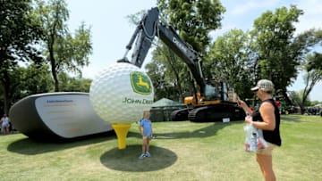 SILVIS, ILLINOIS - JULY 13: Fans take pictures in front of a tractor during the third round of the John Deere Classic at TPC Deere Run on July 13, 2019 in Silvis, Illinois. (Photo by Dylan Buell/Getty Images)
