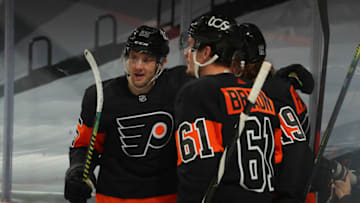 PHILADELPHIA, PA - JANUARY 15: James van Riemsdyk #25, Justin Braun #61, and Nolan Patrick #19 of the Philadelphia Flyers celebrate a goal by Travis Konecny #11 (not pictured) against the Pittsburgh Penguins in the first period at the Wells Fargo Center on January 15, 2021 in Philadelphia, Pennsylvania. (Photo by Mitchell Leff/Getty Images)