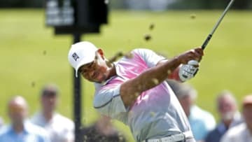 Jul 31, 2014; Akron, OH, USA; Tiger Woods driving on the seventh hole during the first round of the WGC-Bridgestone Invitational golf tournament at Firestone Country Club - South Course. Mandatory Credit: Joe Maiorana-USA TODAY Sports
