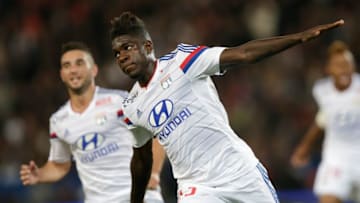 Lyon's French Cameroonian defender Samuel Umtiti reacts after scoring an equalizer during the French L1 football match Paris Saint-Germain (PSG) vs Lyon (OL) on September 21, 2014 at the Parc des Princes stadium in Paris. AFP PHOTO / KENZO TRIBOUILLARD (Photo credit should read KENZO TRIBOUILLARD/AFP/Getty Images)