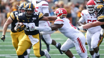 IOWA CITY, IOWA- SEPTEMBER 7: Running back Toren Young #28 of the Iowa Hawkeyes rushes up field during the first half past linebacker Tyshon Fogg #8 of the Rutgers Scarlet Knights on August 31, 2019 at Kinnick Stadium in Iowa City, Iowa. (Photo by Matthew Holst/Getty Images)