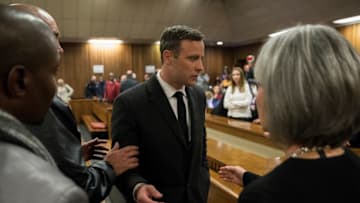PRETORIA, SOUTH AFRICA - JULY 6: Olympic athlete Oscar Pistorius speaks with relatives after sentencing at the High Court on July 6, 2016 at the High Court in Pretoria, South Africa. Pistorius was sentenced to six years in prison for the murder of girlfriend Reeva Steenkamp at their home in 2013. (Photo by Marco Longari - Pool/Getty Images)