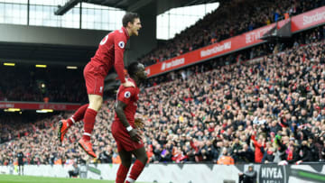 LIVERPOOL, ENGLAND - APRIL 14: Sadio Mane of Liverpool celebrates after scoring his team's first goal with Andy Robertson during the Premier League match between Liverpool FC and Chelsea FC at Anfield on April 14, 2019 in Liverpool, United Kingdom. (Photo by Michael Regan/Getty Images)