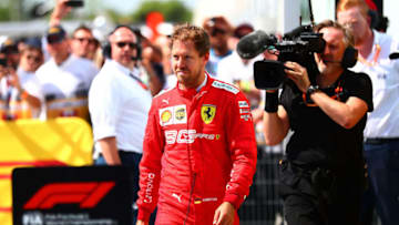 MONTREAL, QC - JUNE 09: Sebastian Vettel of Germany and Ferrari walks in to parc ferme to swap the 1st and 2nd place boards after the F1 Grand Prix of Canada at Circuit Gilles Villeneuve on June 9, 2019 in Montreal, Canada. (Photo by Dan Istitene/Getty Images)