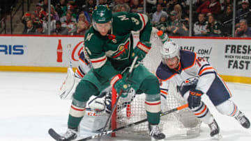 ST. PAUL, MN - APRIL 2: Charlie Coyle #3 of the Minnesota Wild handles the puck with Ethan Bear #74 of the Edmonton Oilers defending during the game at the Xcel Energy Center on April 2, 2018 in St. Paul, Minnesota. (Photo by Bruce Kluckhohn/NHLI via Getty Images)