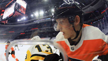 PHILADELPHIA, PENNSYLVANIA - JANUARY 13: Brandon Tanev #13 of the Pittsburgh Penguins backs James van Riemsdyk #25 of the Philadelphia Flyers into the boards during the second period at the Wells Fargo Center on January 13, 2021 in Philadelphia, Pennsylvania. (Photo by Bruce Bennett/Getty Images)