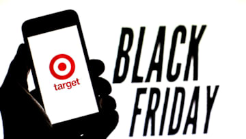 SPAIN - 2021/11/16: In this photo illustration, a Target Corporation logo is seen on a smartphone screen with 'Black Friday' words in the background. (Photo Illustration by Thiago Prudêncio/SOPA Images/LightRocket via Getty Images)