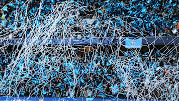 MANCHESTER, ENGLAND - APRIL 26: Fans of Manchester City wave flags and release streamers before the UEFA Champions League Semi Final first leg match between Manchester City FC and Real Madrid at the Etihad Stadium on April 26, 2016 in Manchester, United Kingdom. (Photo by Matthew Ashton - AMA/Getty Images)