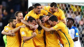SYDNEY, AUSTRALIA - NOVEMBER 15: (EDITORS NOTE: Re-crop of image 874400490) Mile Jedinak of Australia celebrates with his team mates after scoring a goal during the 2018 FIFA World Cup Qualifiers Leg 2 match between the Australian Socceroos and Honduras at ANZ Stadium on November 15, 2017 in Sydney, Australia. (Photo by Mark Kolbe/Getty Images)