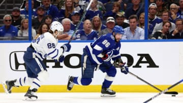 Apr 22, 2023; Tampa, Florida, USA; Tampa Bay Lightning right wing Nikita Kucherov (86) skates with the puck against Toronto Maple Leafs right wing William Nylander (88) during the third period in game three of the first round of the 2023 Stanley Cup Playoffs at Amalie Arena. Mandatory Credit: Kim Klement-USA TODAY Sports