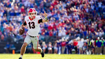 Stetson Bennett runs for yardage against the Florida Gators. (Photo by James Gilbert/Getty Images)