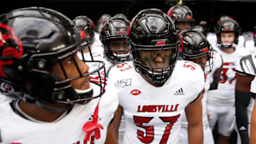 MIAMI, FLORIDA - NOVEMBER 09: Dayna Kinnaird #57 of the Louisville Cardinals waits to take the field prior to the game against the Miami Hurricanes at Hard Rock Stadium on November 09, 2019 in Miami, Florida. (Photo by Michael Reaves/Getty Images)
