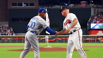 ATLANTA, GA - OCTOBER 07: Manager Dave Roberts #30 of the Los Angeles Dodgers shakes hands with manager Brian Snitker #43 of the Atlanta Braves before Game Three of the National League Division Series at SunTrust Park on October 7, 2018 in Atlanta, Georgia. (Photo by Scott Cunningham/Getty Images)