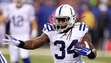 Aug 16, 2014; Indianapolis, IN, USA; Indianapolis Colts running back Trent Richardson (34) runs with the ball against the New York Giants at Lucas Oil Stadium. Mandatory Credit: Brian Spurlock-USA TODAY Sports